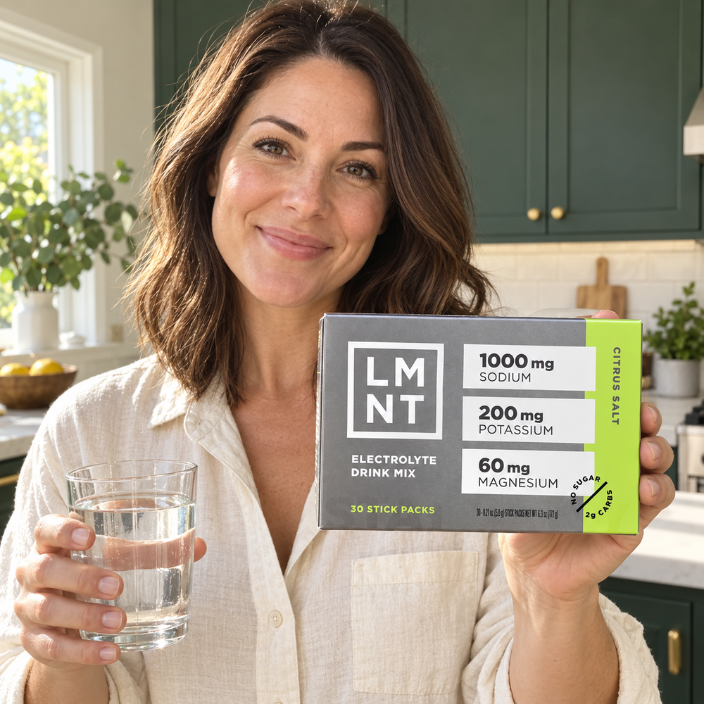 Lifestyle illustration: woman presenting the LMNT Citrus Salt 30-stick box