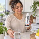 AI-generated lifestyle illustration of a woman holding Cutler Carnitine in a kitchen