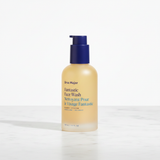 Ursa Major Fantastic Face Wash amber pump bottle three-quarter angle on white marble