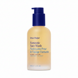 Ursa Major Fantastic Face Wash amber yellow pump bottle close-up on white background