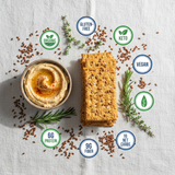 Flackers Sea Salt flat lay with hummus and nutritional claims on white linen