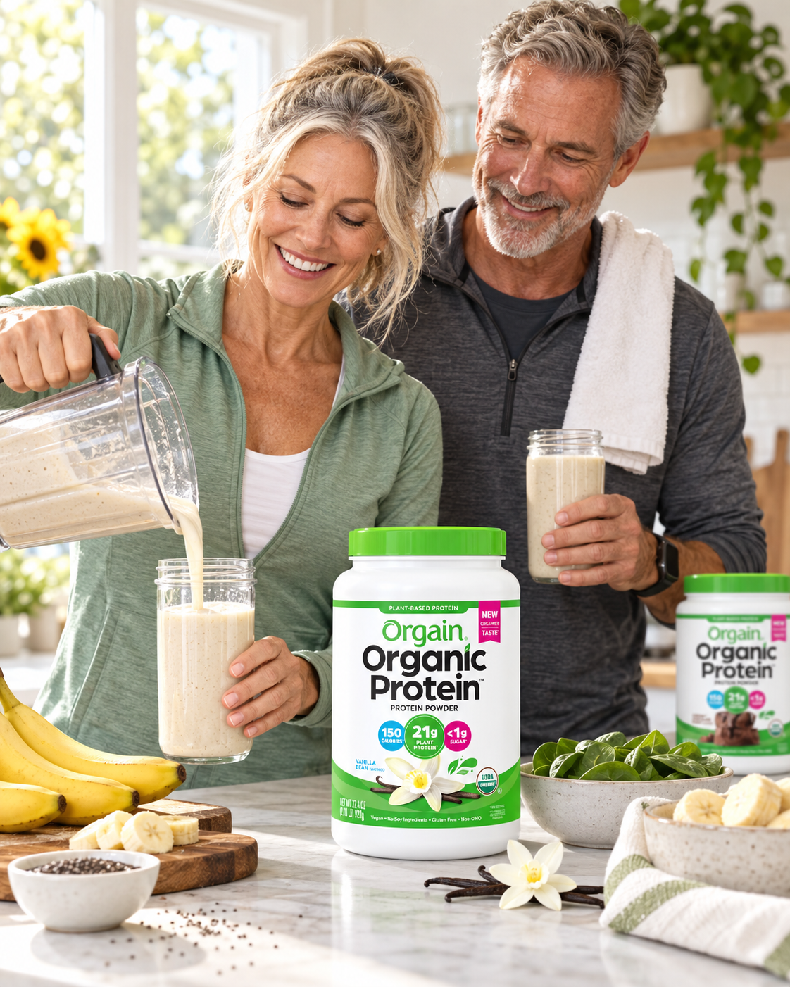 Active older couple preparing an Orgain protein smoothie in a bright kitchen