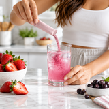 Illustrative Strawberry Açaí drink-mix preparation scene